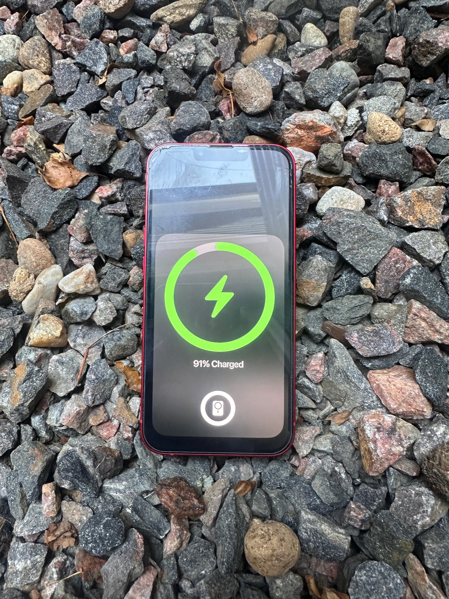 Slim profile magnetic wireless charger V1 charging a phone through case