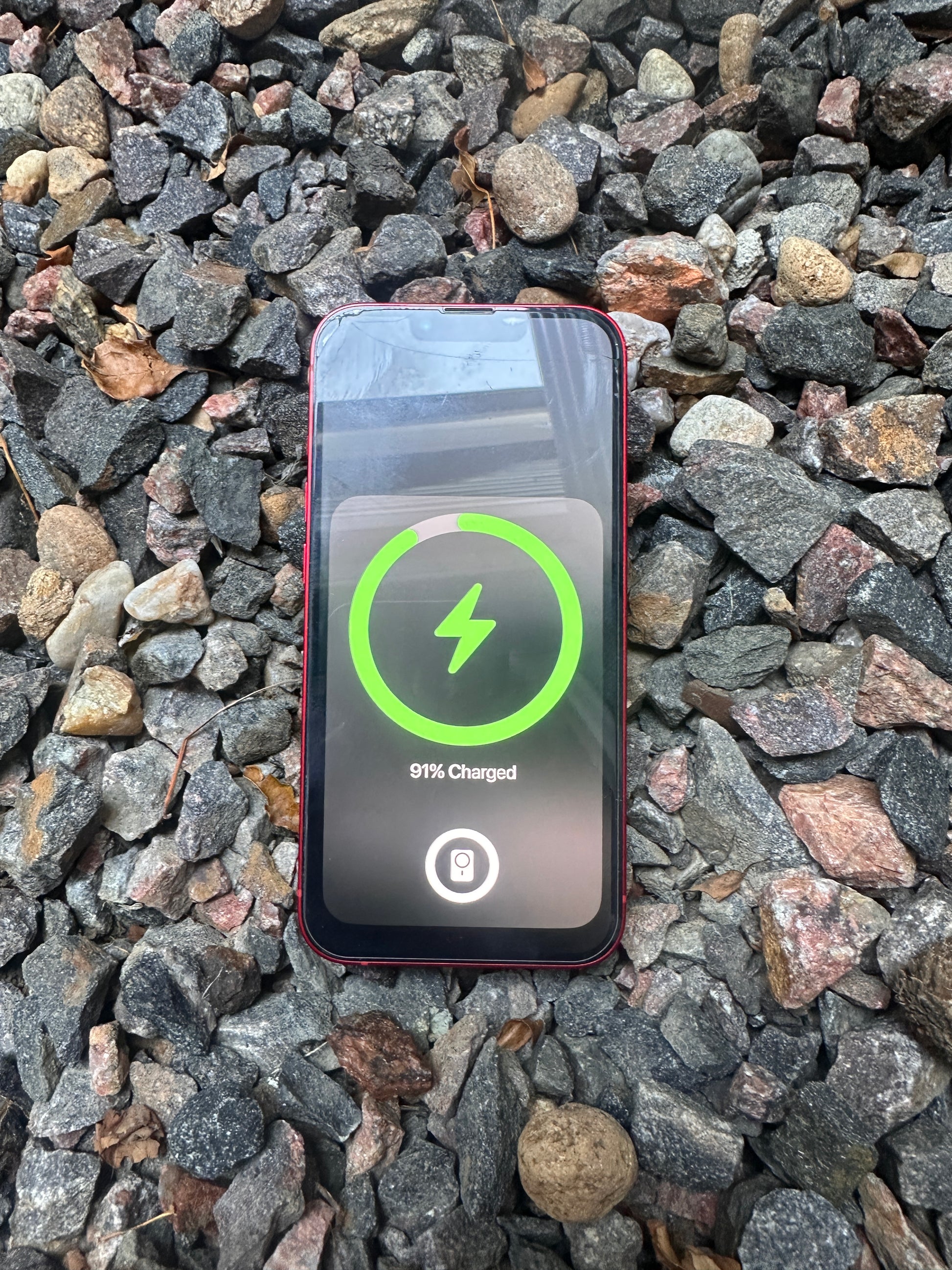Slim profile magnetic wireless charger V1 charging a phone through case