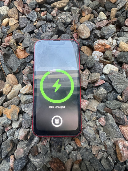 Slim profile magnetic wireless charger V2 charging a phone through case